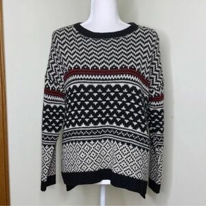 Black and White Patterned Sweater with Red Accents